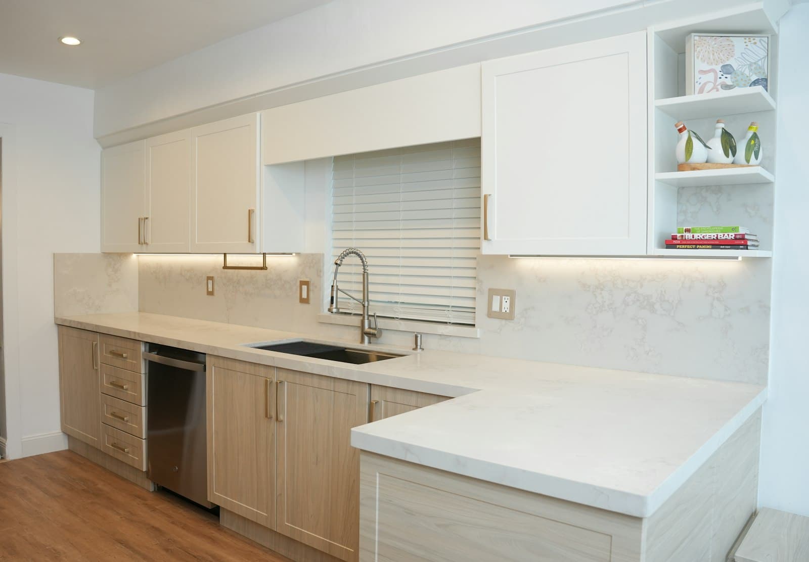Built-in dishwasher in a modern white kitchen