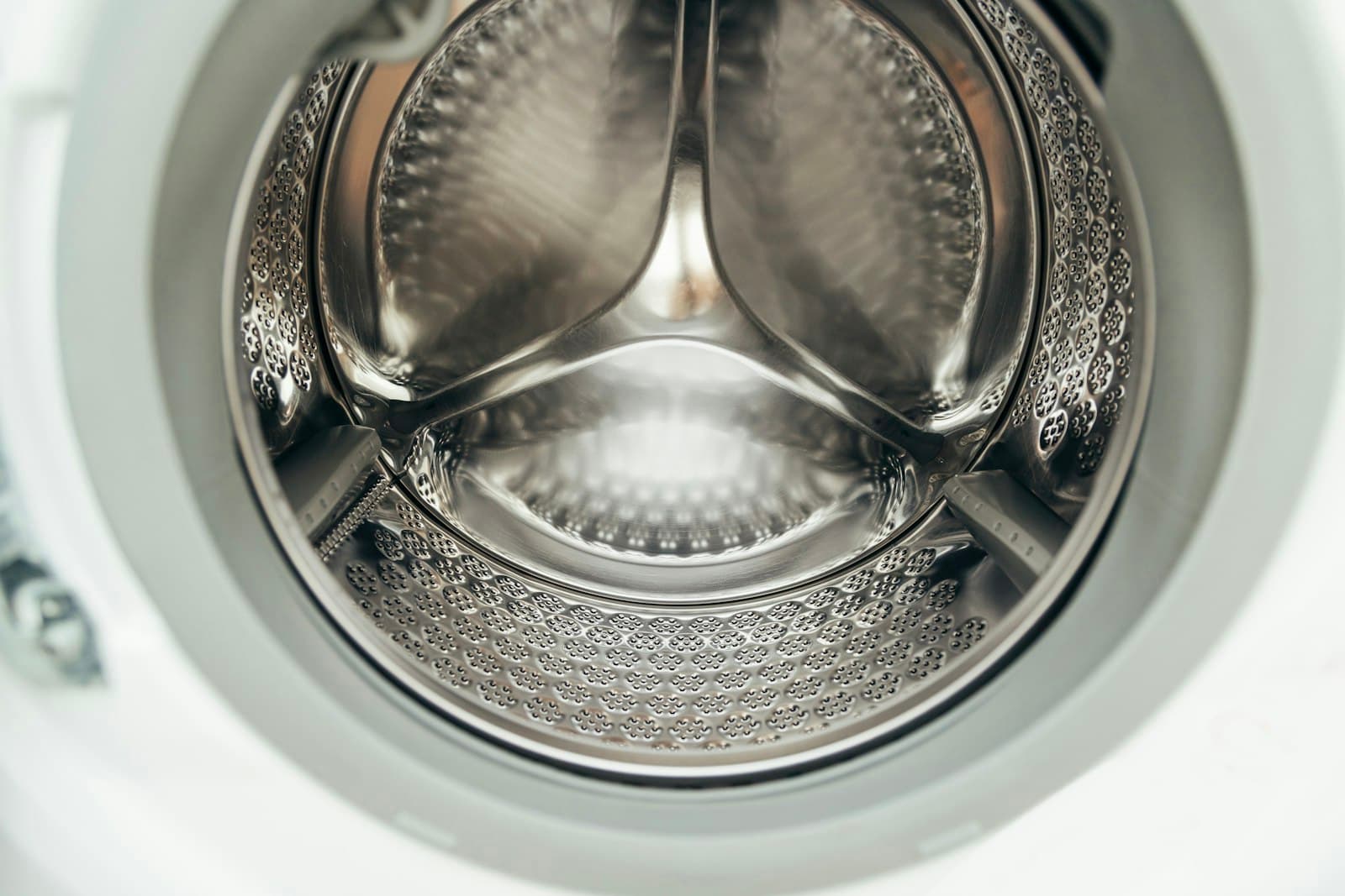 Interior of a clean, empty washing machine drum
