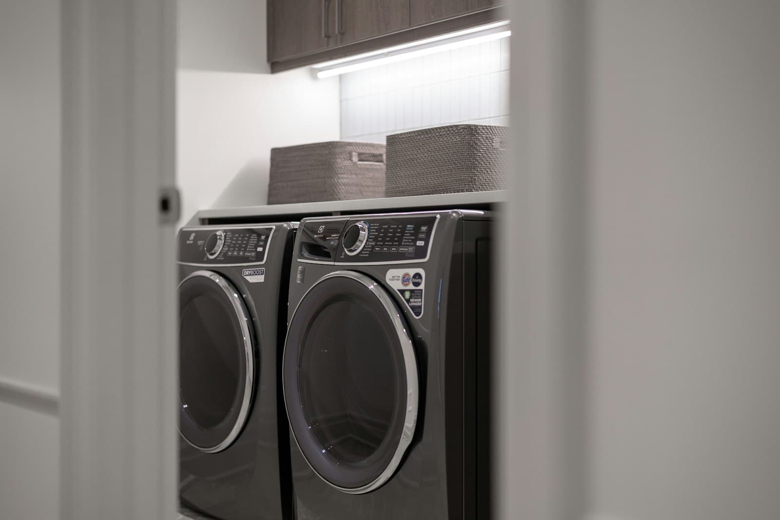 Modern laundry room with a front-load washer and dryer